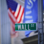 Wall Street reverses course to trade lower as health stocks drag