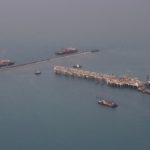 U.S. oil benchmark ends slightly lower as trade-war worries limit upside